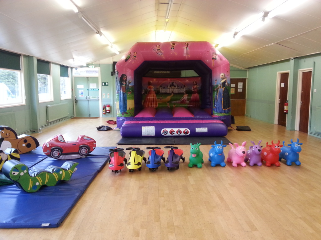 Hall for party with bouncy castle and toys